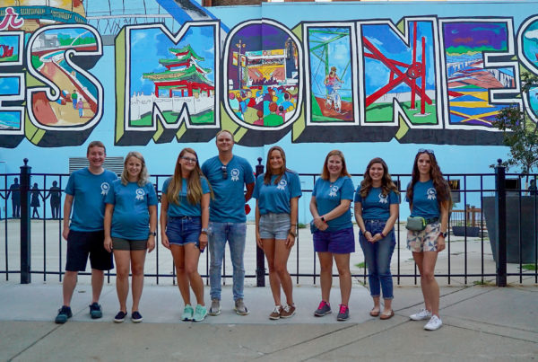 Neapolitan Labs team in front of Des Moines mural