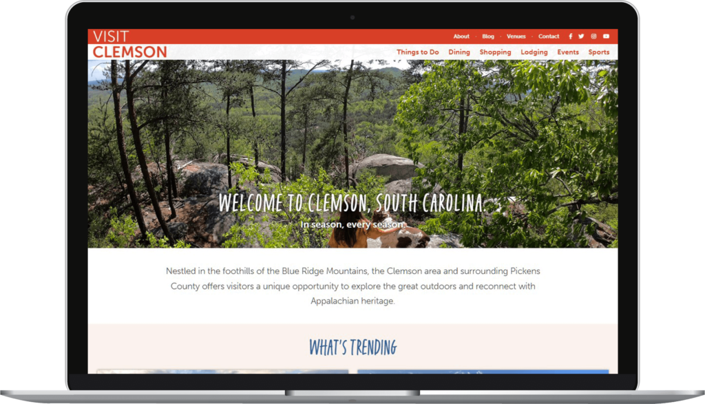 The homepage of the Visit Clemson website displayed on a computer screen.