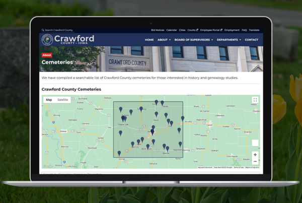Neapolitan Labs' cemetery feature showcased on the Crawford County website, as viewed on a laptop.