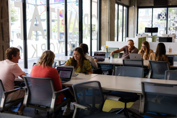 Neapolitan Labs team in their office space brainstorming for the coming year.