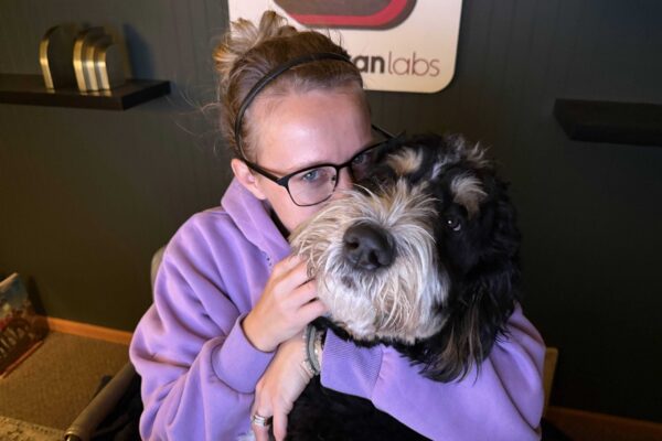 Kimber, Neapolitan Labs senior project manager, with her dog, Ruger.